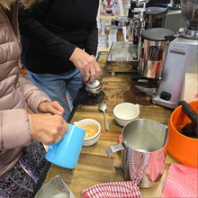 Load image into Gallery viewer, 2 people learning to make coffee with the home barista training