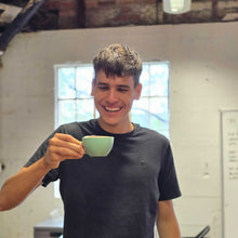 Load image into Gallery viewer, enjoying a cup of coffee after learning how to pour a flat white
