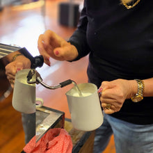 Load image into Gallery viewer, person learning how to froth milk on a home espresso machine
