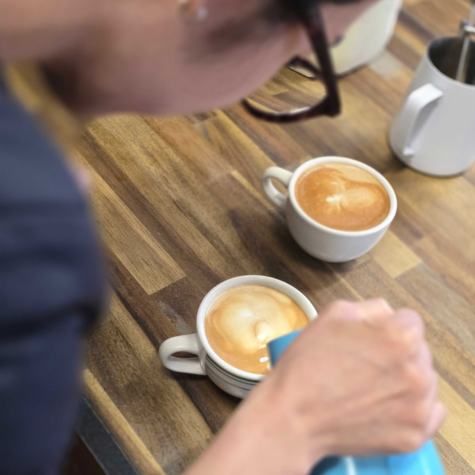 student learning how to make coffee in a one on one training session